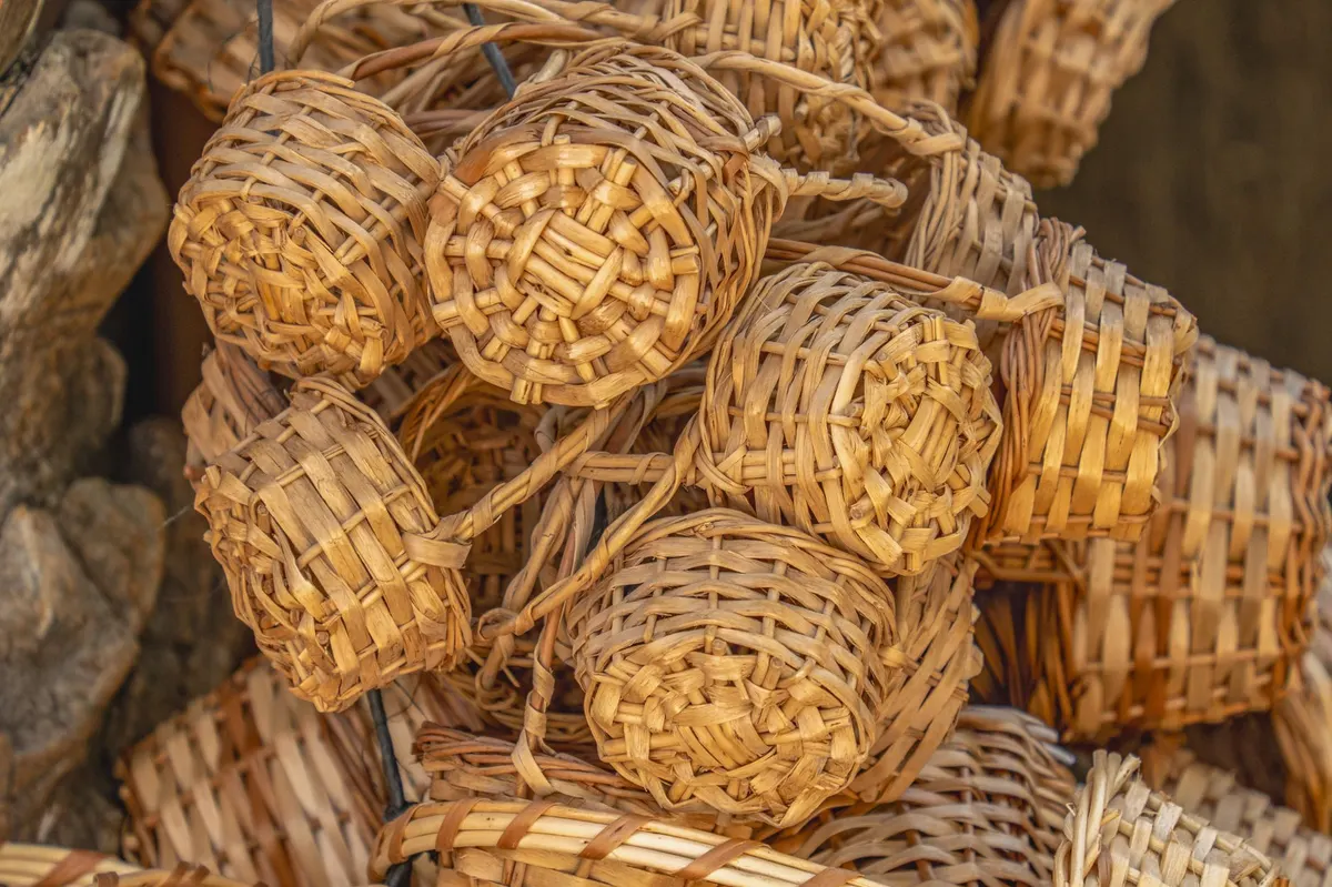close up of aged wicker basket texture with linen towels