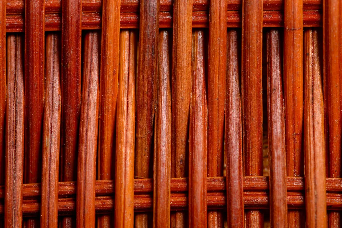 vintage wicker magazine rack close up, rustic home decor