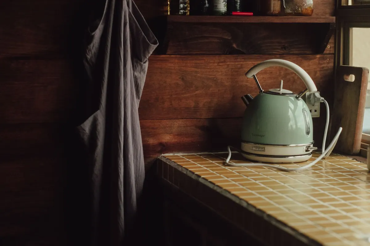 vintage wooden desktop organizer on a rustic kitchen counter