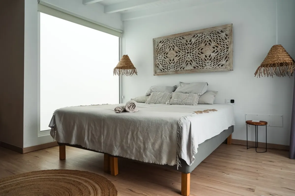 finished woven rush bench bedroom interior warm neutral styling