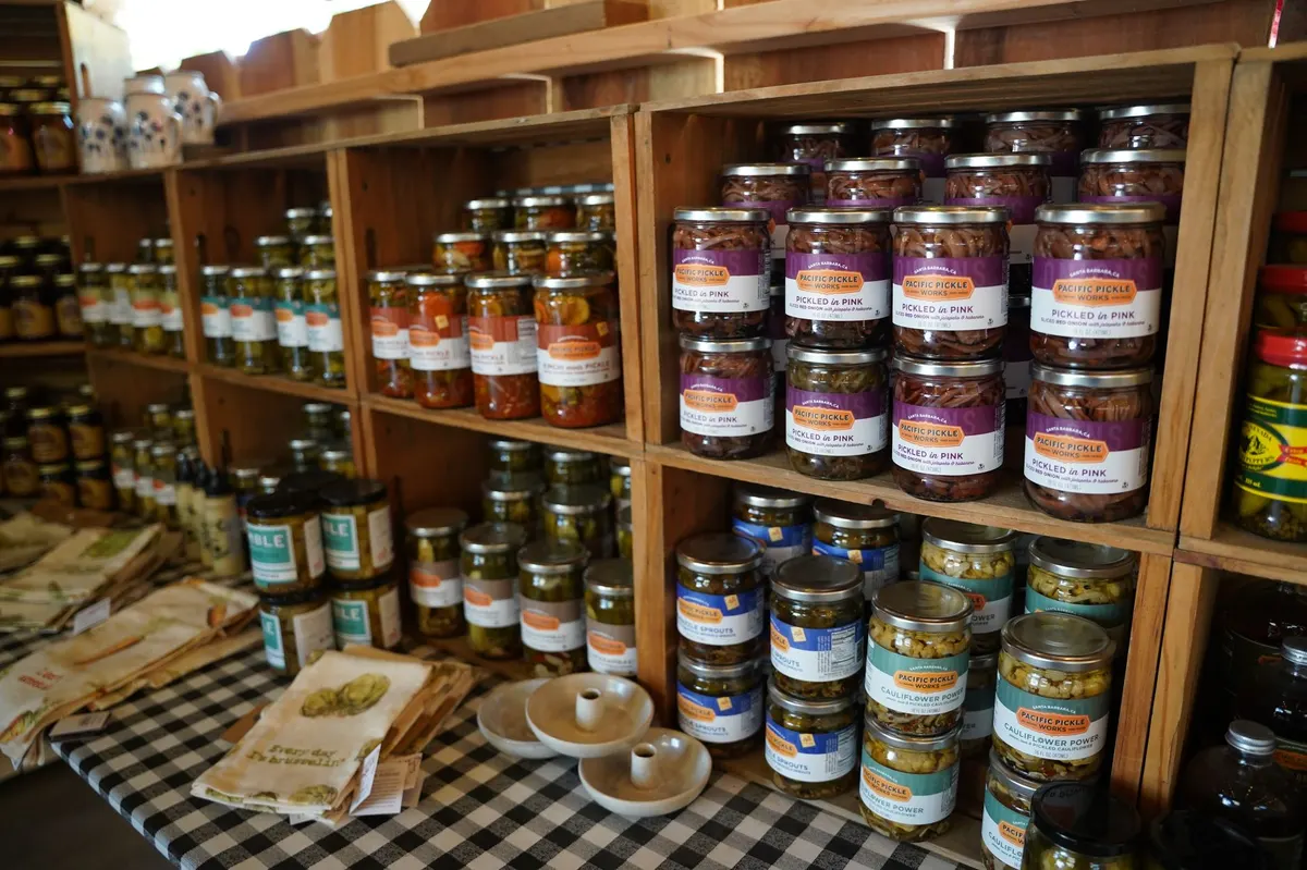 thrift store glass canisters on shelf before transformation