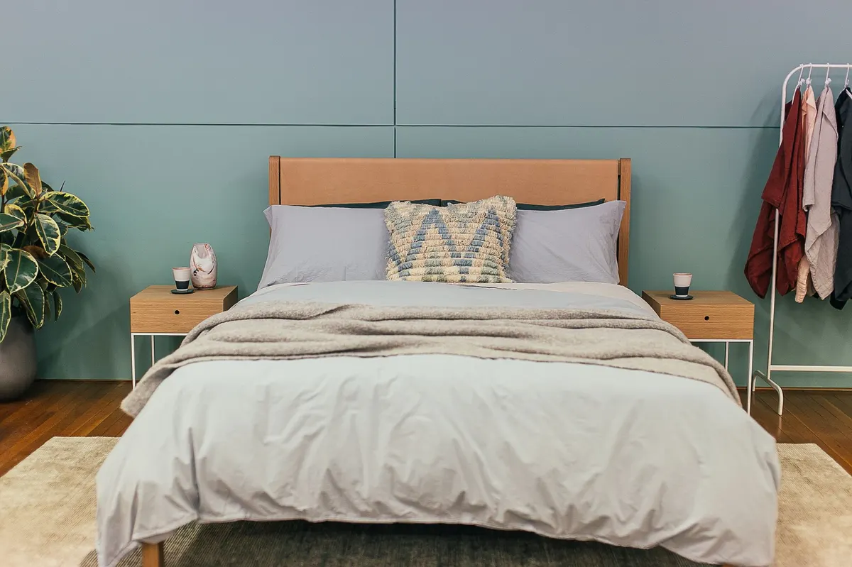 cozy bedroom layered blankets warm light