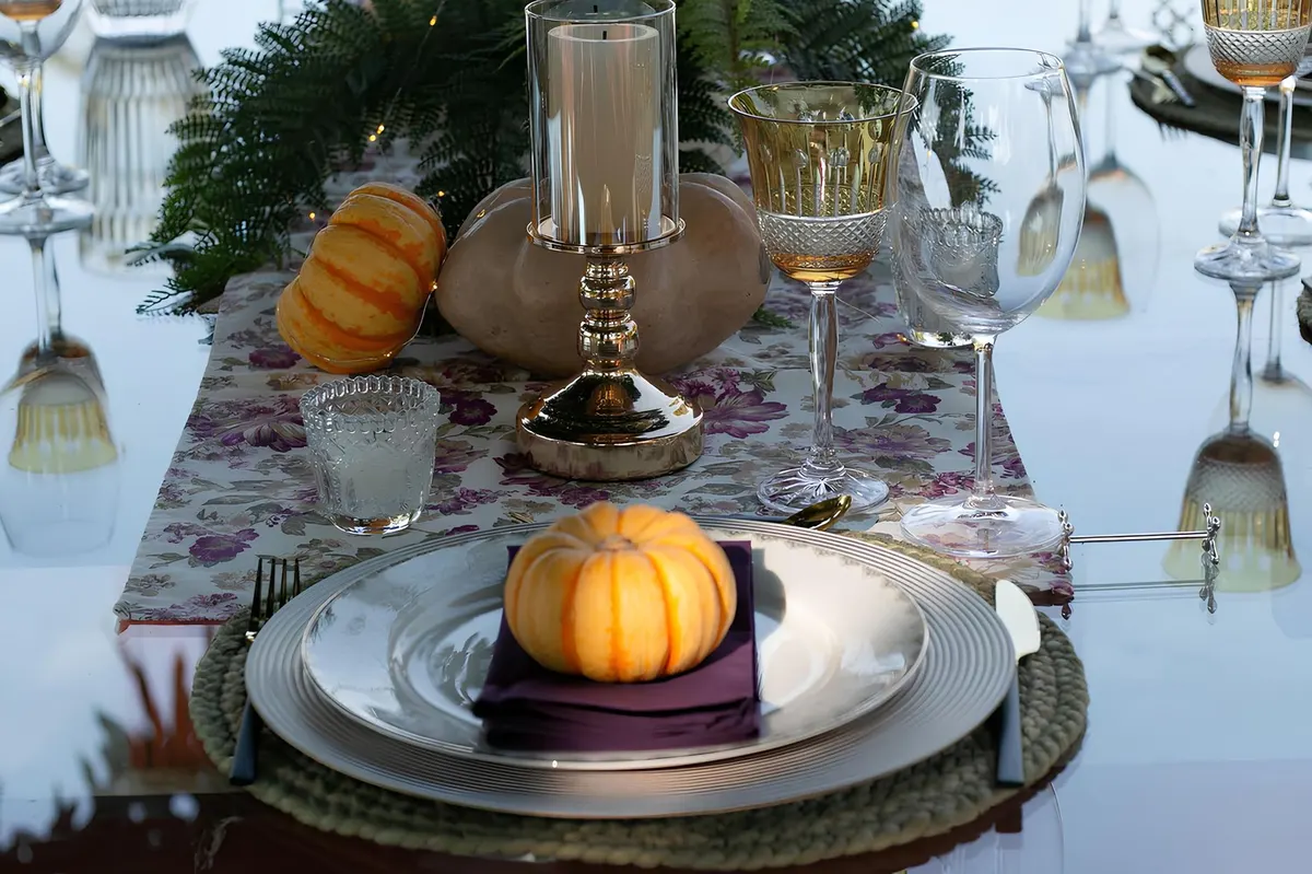 brass candlesticks autumn foliage table centerpiece