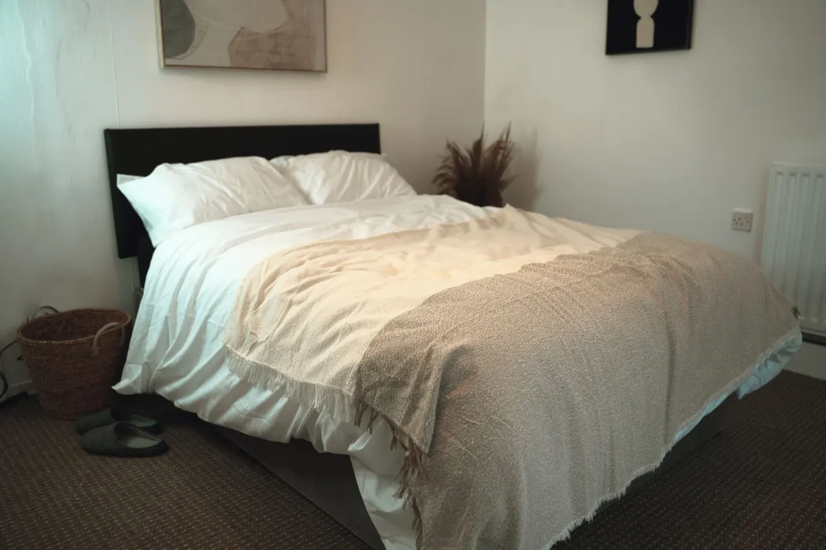 cozy bedroom scene with blanket basket